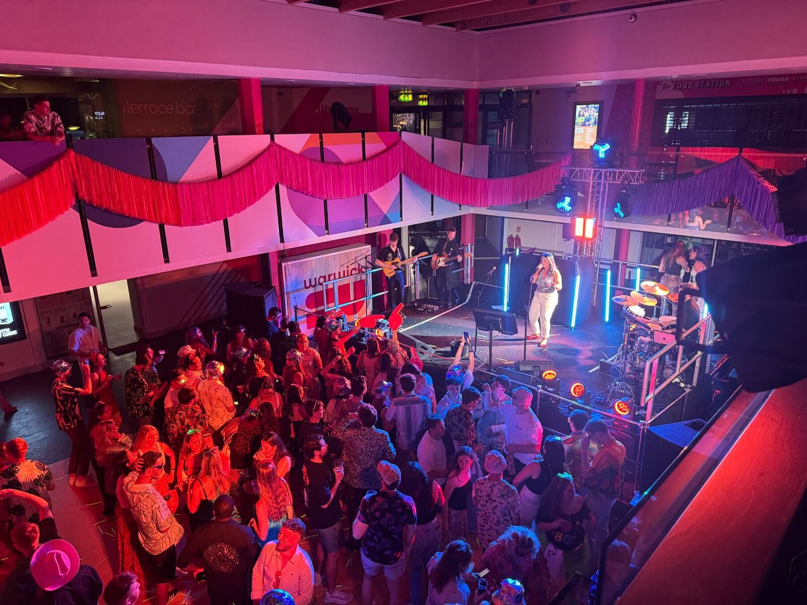 Bandeoke event with a live audience and stage lighting