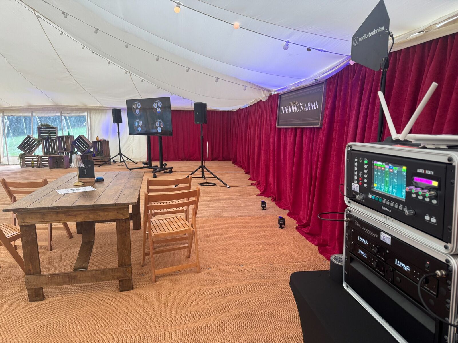 Small event setup with a 75 inch screen and PA system